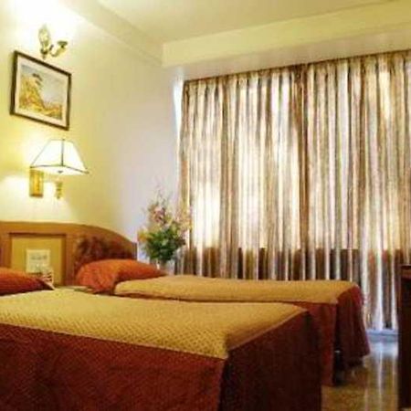 Hotel Mandakini Ambience Pune Oda fotoğraf